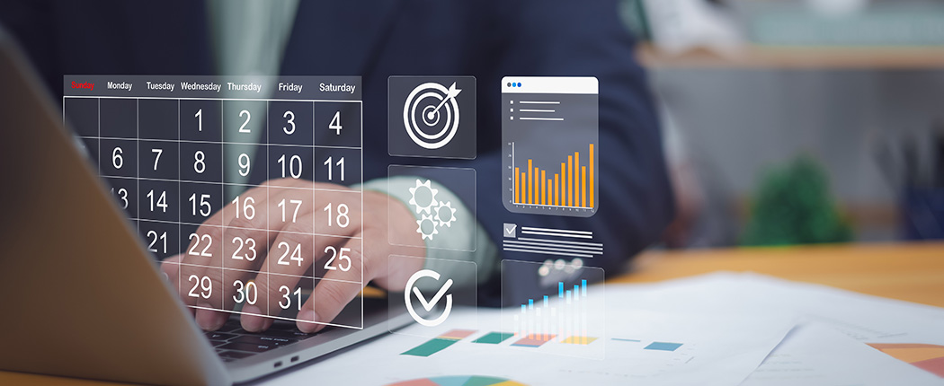 Person working on a digital calendar managing their committed expenditure.